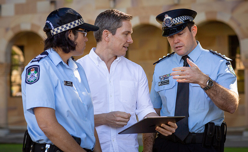 UQ researcher with QPS officers