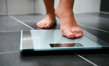 person standing on scales