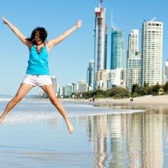 teenager jumping on the beach