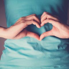 woman's hand in shape of heart