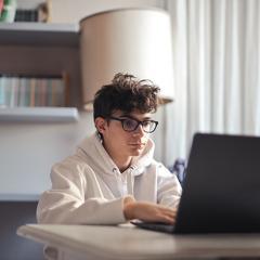 Teen boy on laptop
