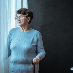 woman looking out window