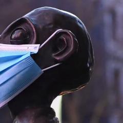 statue wearing a facemask