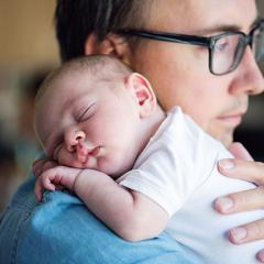 Father holding newborn baby