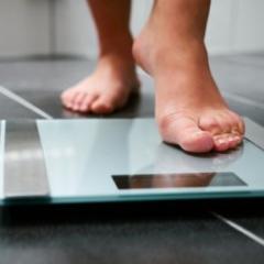 person standing on scales