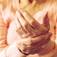 woman holding sore hand