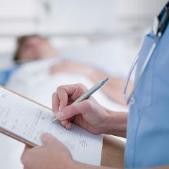 nurse reading chart