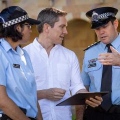 UQ researcher with QPS officers