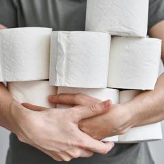man holding toilet paper